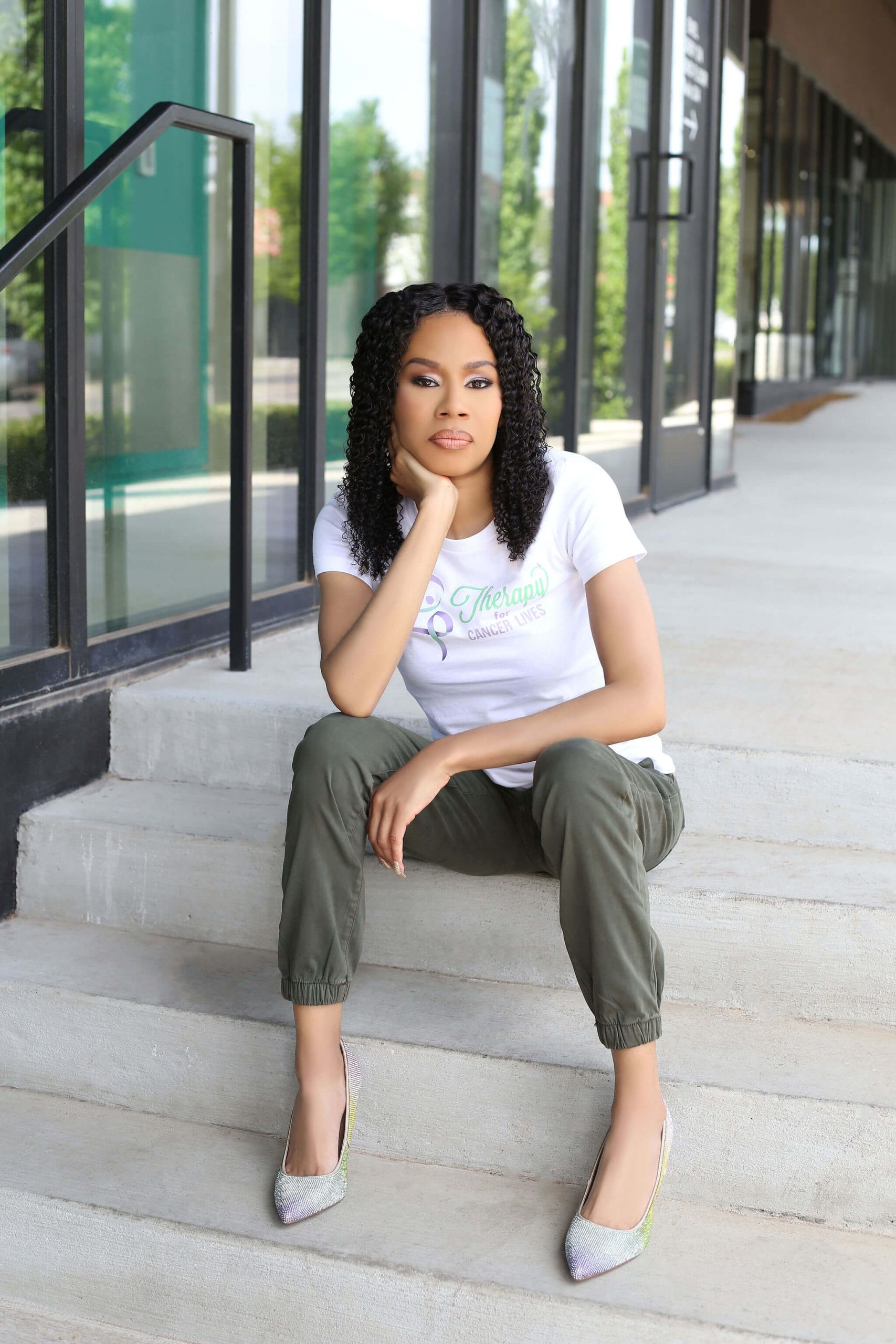 Shaunica Byrd with logo on steps